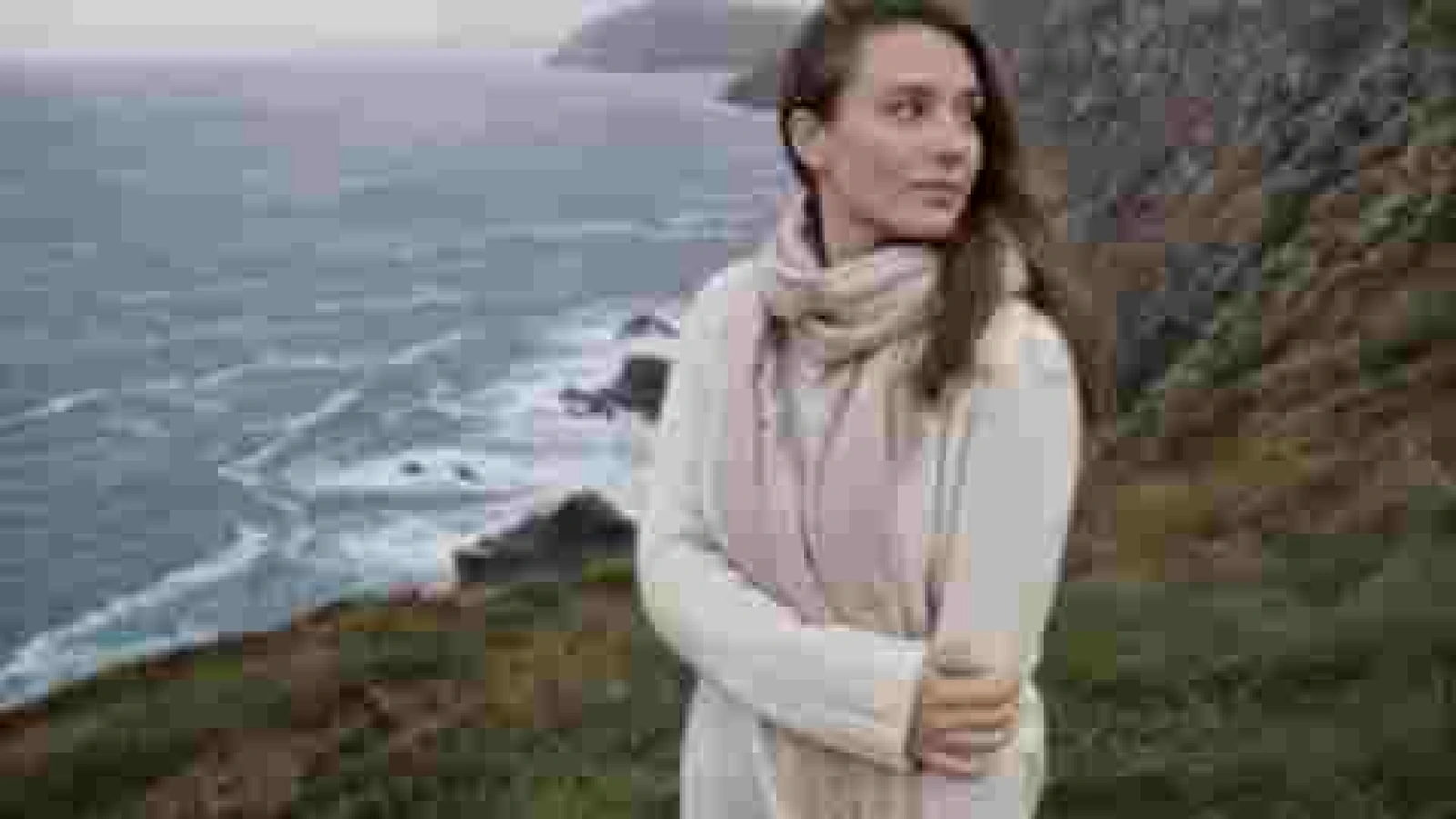 Soft low-quality coastal cliff portrait before Pixelyft enhancement