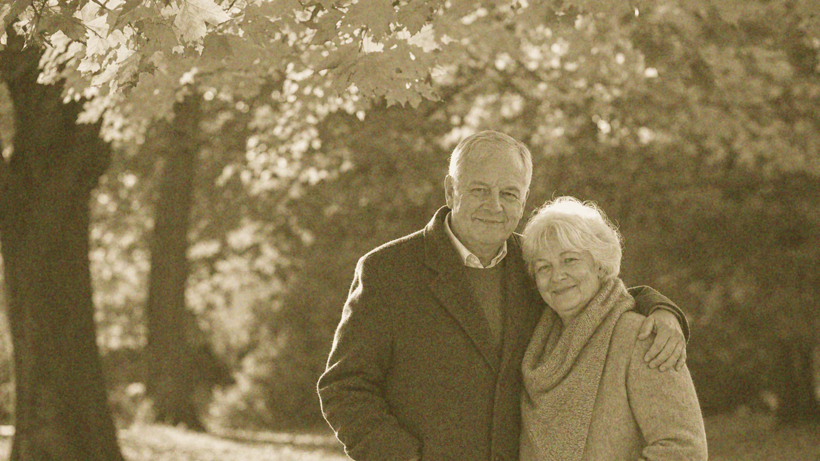 Faded old autumn couple photo before Pixelyft restoration